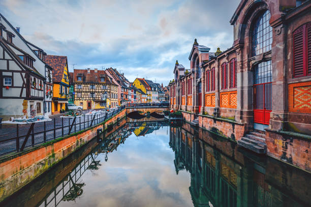 Petit Venice, Colmar, France Water canal and traditional colored houses reflected in river Lauch at Christmas time in Little Venise Colmar Haut-Rhin department Alsace France Europe colmar stock pictures, royalty-free photos & images