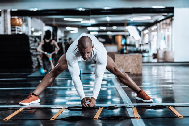 istock Man stretching in the gym before exercise 867345562