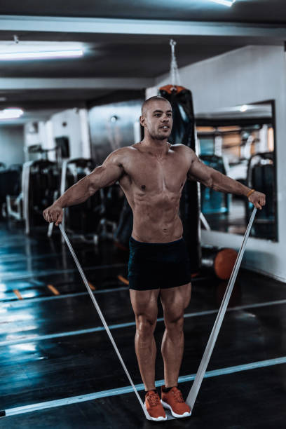 istock Man exercising and doing push-ups in the local gym 867348478