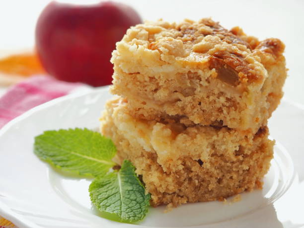 Two pieces of coffeecake on white plate. Fresh crumble pie with streusel topping. stock photo