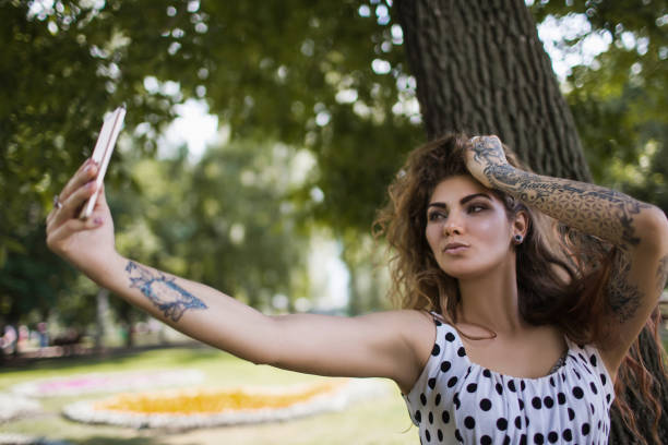 istock stylish hipster girl with mobile phone 867360188