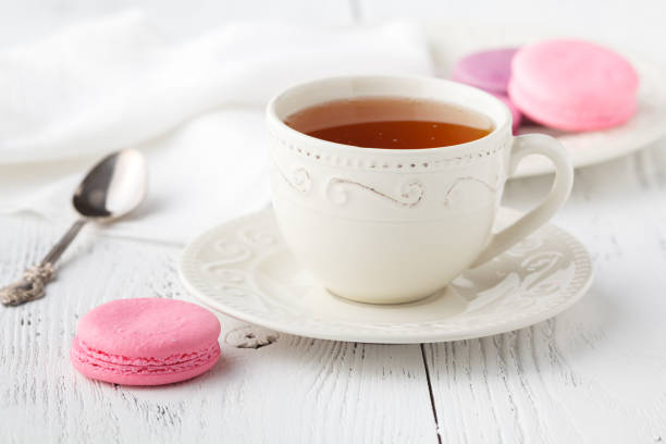 istock Cup of tea and Macaroons on vintage pastel background 867362822