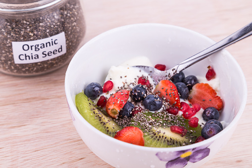 Chia seeds with fresh fruits and yogurt, healthy nutritious anti-oxidant superfood breakfast for whole family