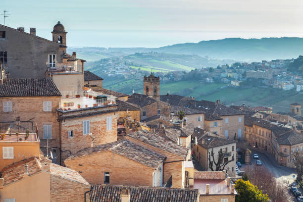 Small Italian town under brignt morning sky Small Italian town under brignt morning sky. Province of Fermo, Italy marche italy stock pictures, royalty-free photos & images