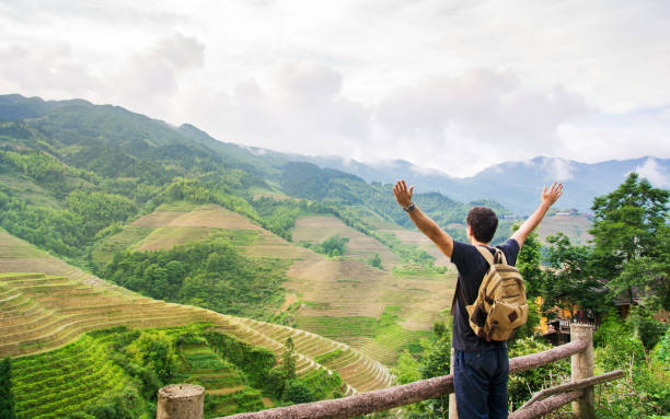 istock Man enjoying rice terrace scenery 867382926