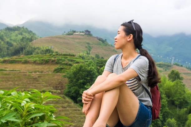 istock Girl admiring rice terrace scenery 867383420