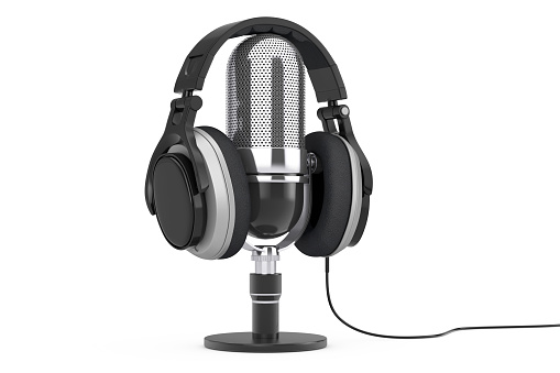 Black Headphones over Microphone on a white background. 3d Rendering