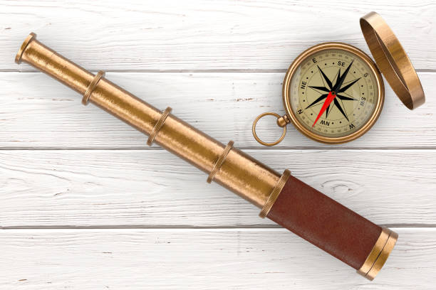 Golden Vintage Telescope Spyglass with Compass over Wooden Table. 3d Rendering