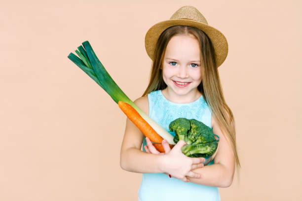 istock Little girl with vegetables. 867386920