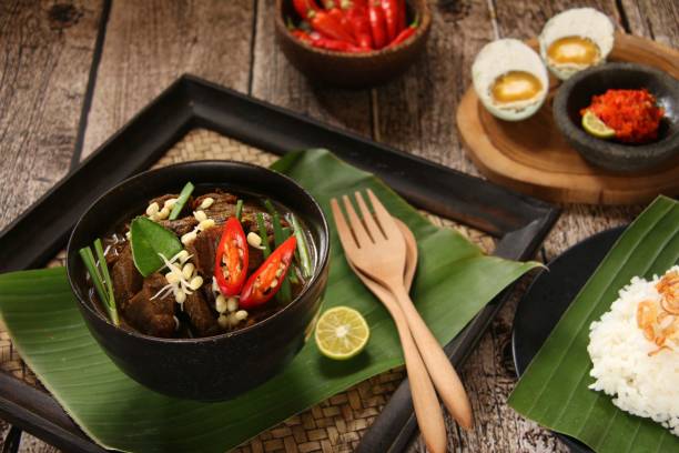 istock Rawon, a Traditional Javanese Beef Soup in Keluak Fruit Broth 867387002