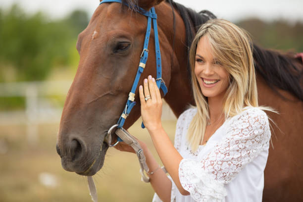 istock Woman with the horse 867390330