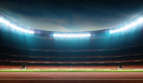 illuminated night soccer stadium with running track, 3D stadium, digitally generated image