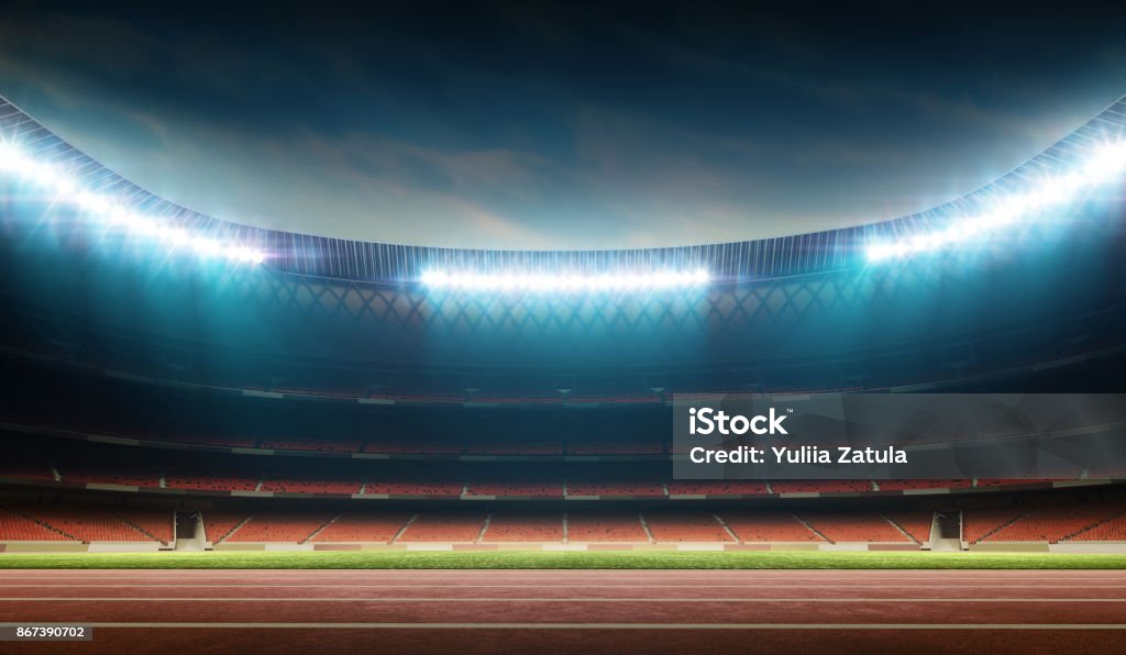 track and field stadium illuminated night soccer stadium with running track, 3D stadium, digitally generated image Track And Field Stock Photo