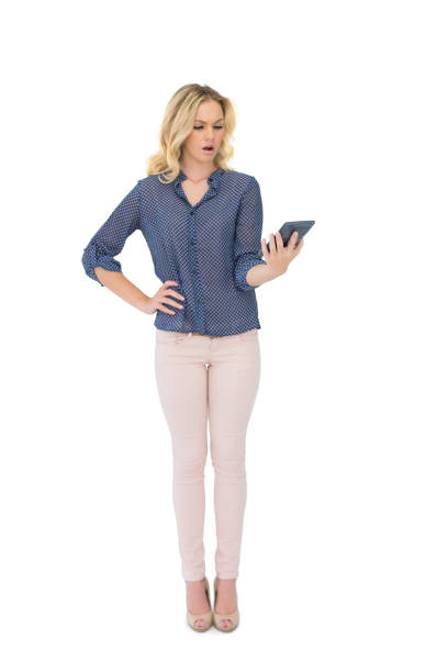 istock Shocked pretty blonde looking at calculator 867391678