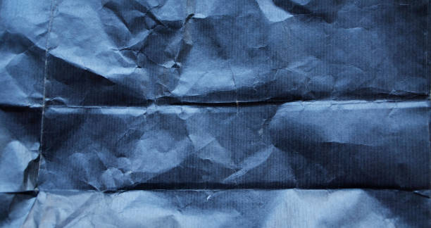 istock Crumpled paper texture, background with copy space. Horizontal stripes 867392106
