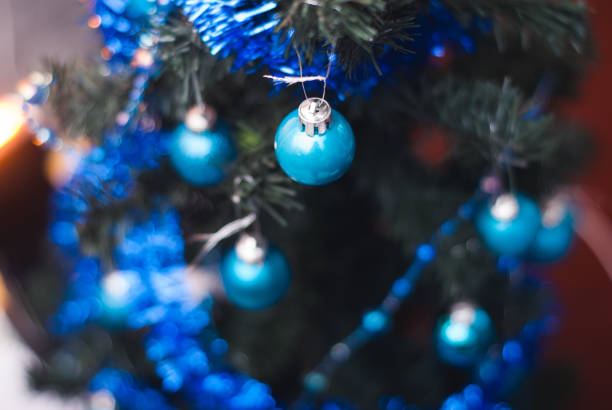istock Christmas tree on wall background, yellow lights, 867392354