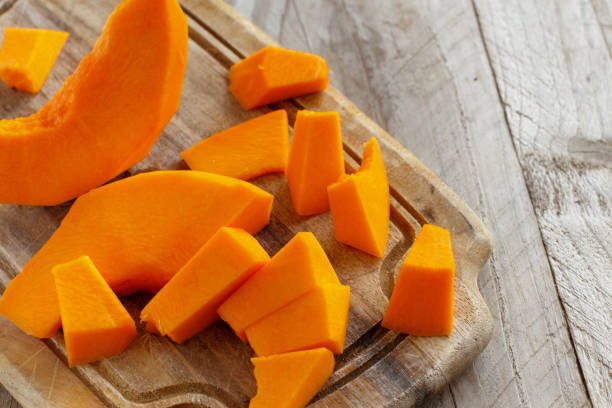istock Pumpkin slices on a wooden background 867394750
