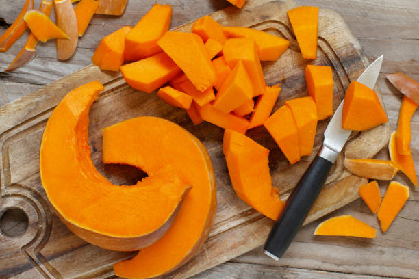 istock Pumpkin slices on a wooden background 867394758