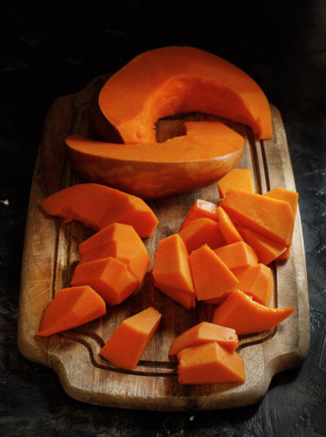 istock Pumpkin slices on a wooden background 867394762