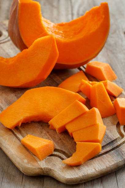istock Pumpkin slices on a wooden background 867394796
