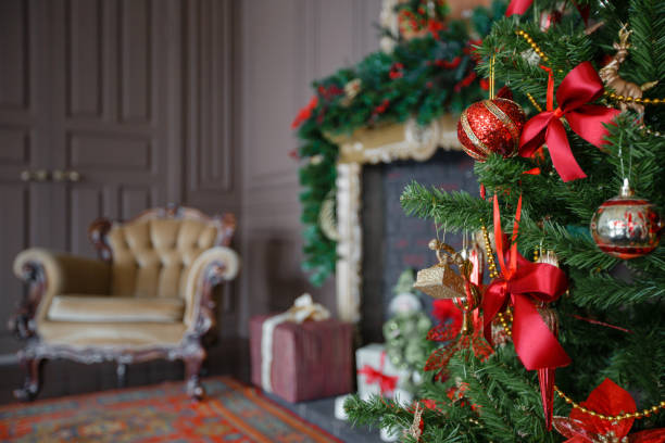 istock Calm image of interior Classic New Year Tree decorated in a room with fireplace 867395094