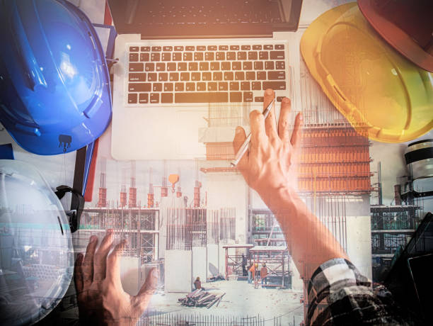 istock Double exposure engineer at workplace with construction site,business concept,industry concept 867395458