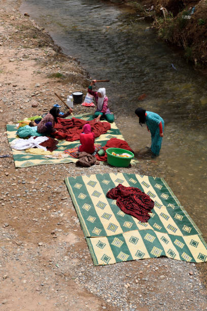 MOROCCO - AUGUST 02: Unidentified people washing clothes in the river in Morocco, August 02, 2015. Morocco is one of the most popular tourist place in North Africa.
