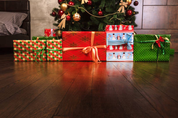 istock colored boxes with gift lines made up of Christmas trees 867399004