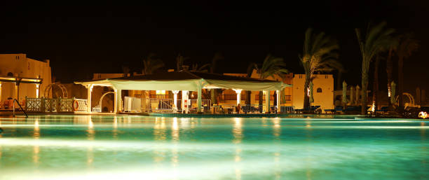 istock night view of the pool and bar 867399020