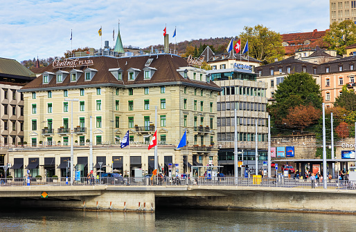 Zurich, Switzerland - 25 October, 2017: people and buildings on Central Square. Central Square is a town square at the northern end of Limmatquai quay. It is one of the city's nodal points for road and public transportation, formerly known as Leonhardplatz.