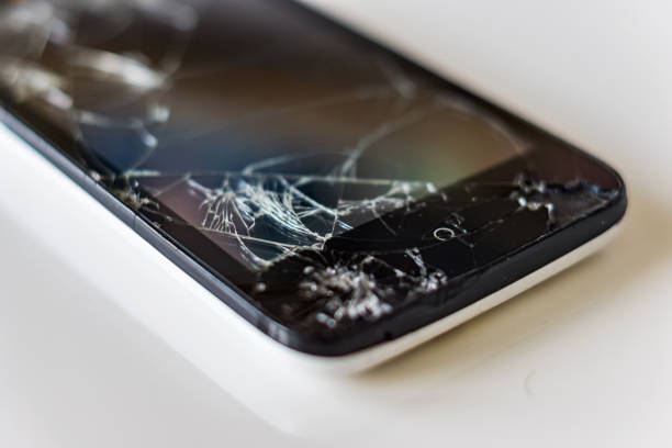 istock Close up of a broken smartphone on a white background. 867415958