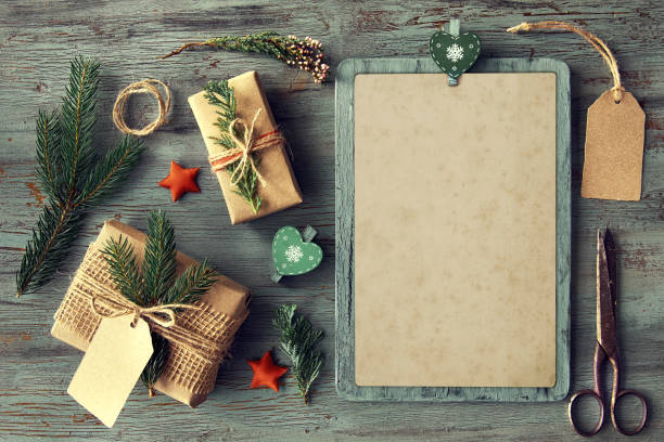 istock Hand crafted gifts on rustic wooden table with Christmas decorations, space 867418086