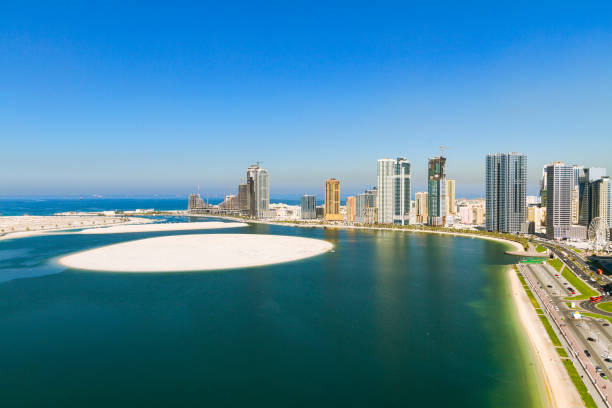 Buildings at Al Khan lagoon, Sharjah View of some of the residential buildings around Al Khan Lagoon in Sharjah city sharjah city stock pictures, royalty-free photos & images