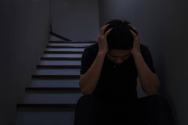 istock Man sit and hold his head with despair. 867422458