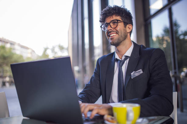 istock Businessman in sidewalk cafe 867432838