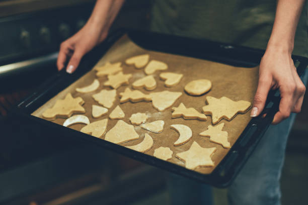 istock person baking christmas cookies 867433542