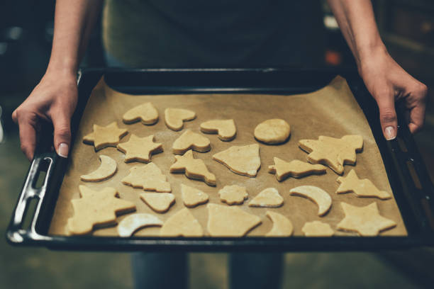 istock person baking christmas cookies 867436096