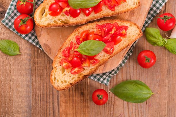 istock Bruschetta bread with basil and chopped tomatoes. 867443254
