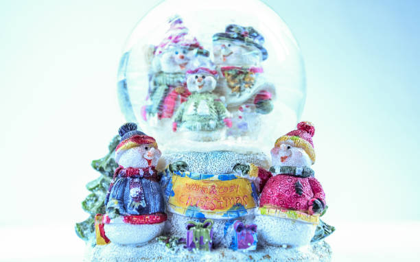 istock Toy snowmen figurines family on white background 867447066