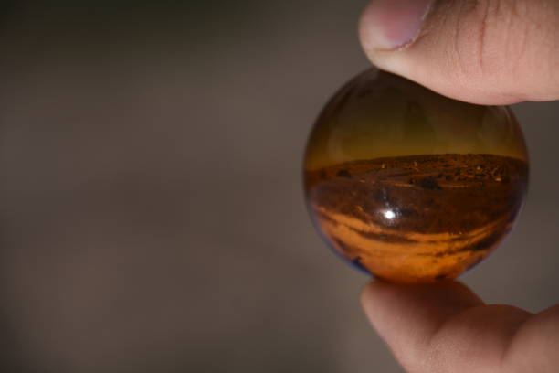 istock Landscapes and agricultural fields  through a crystal ball 867447892