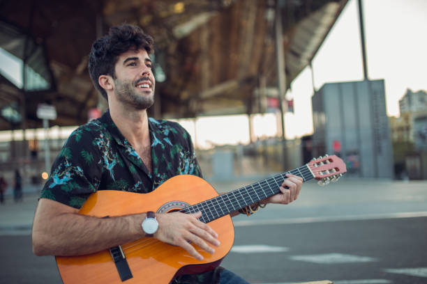 istock Man playing acoustic guitar 867453284
