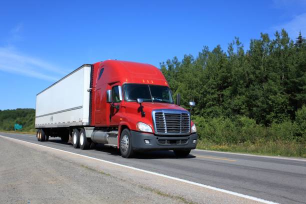 istock Semi truck on highway hauling freight. 867455752