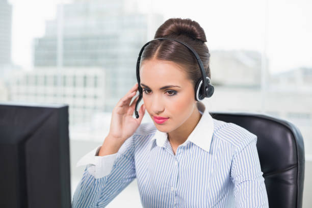 istock Calm brunette businesswoman using headset 867456364