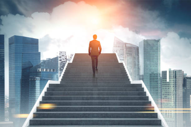 istock Businessman climbing stairs, city 867458838