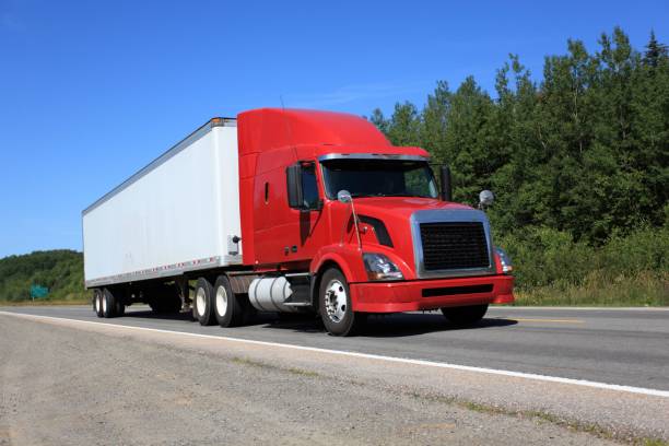 istock Semi truck on highway hauling freight. 867459120