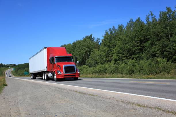 istock Semi truck on highway hauling freight. 867459368