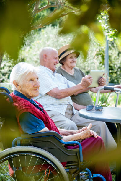 istock Seniors In The Retirement Home Relaxing Outdoors By Using Digital Tablet 867459498