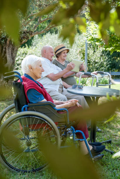 istock Seniors In The Retirement Home Relaxing Outdoors By Using Digital Tablet 867459500