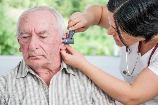 istock Senior Man Visiting Doctor In The Retirement Home 867459620