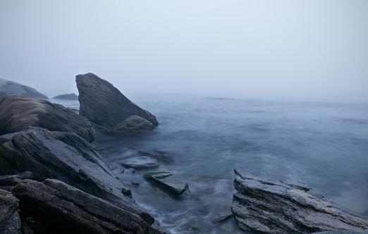 Long exposure of sea and rocks. Fog on the beach, Black Sea